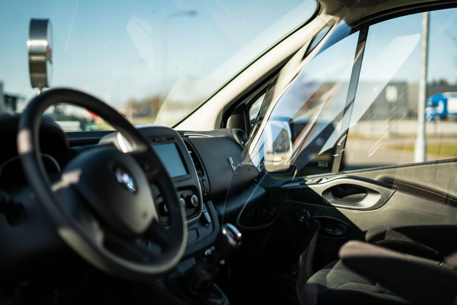 Strong sun through a car’s windows onto the dashboard