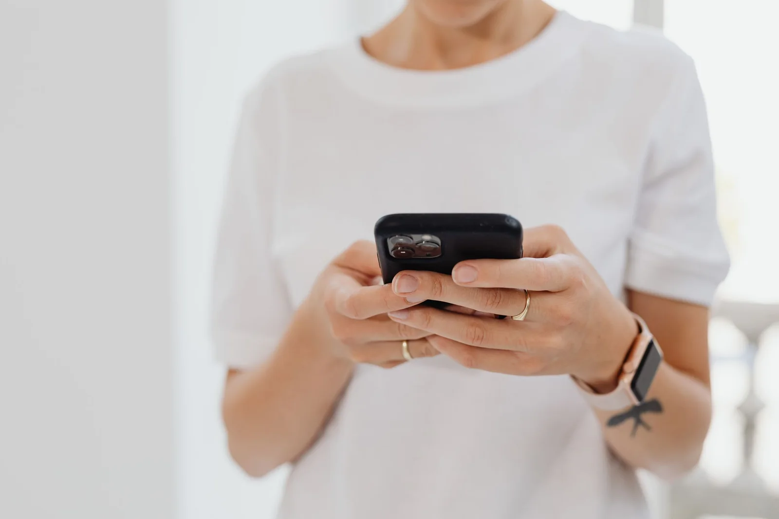 A customer sending a message on a phone