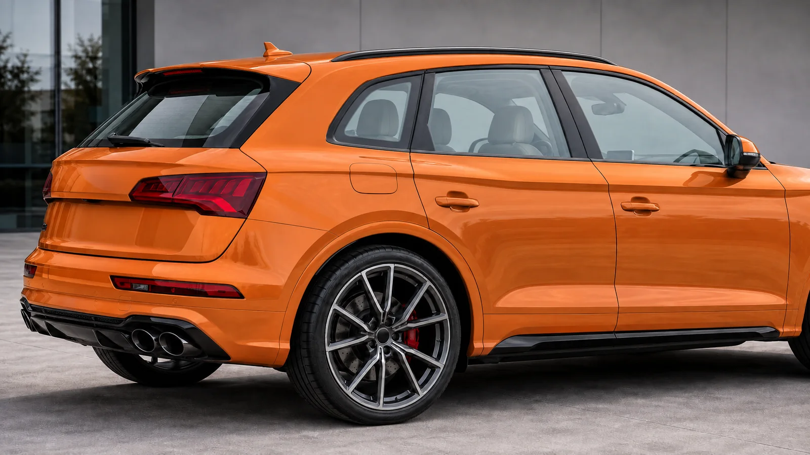 An orange Audi SQ5 with clear, untinted windows