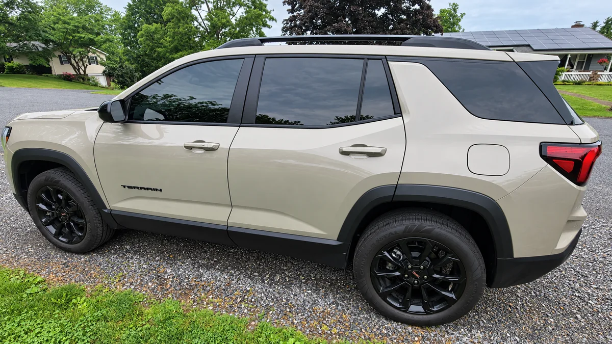A customer’s SUV on a gravel driveway at home, after we tinted its windows